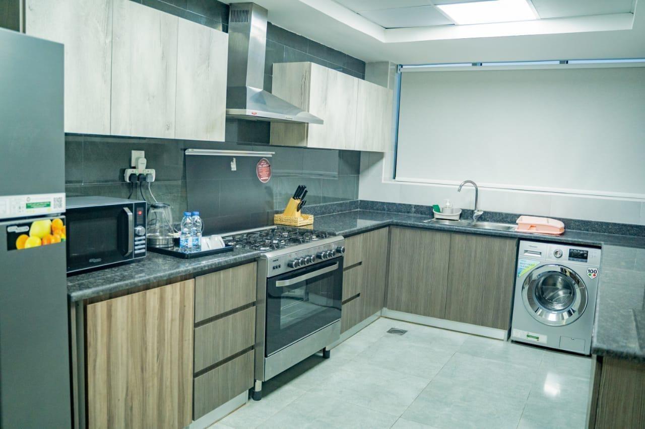 Luxe Grand Hotel Apartments Sharjah Luaran gambar A modern kitchen
