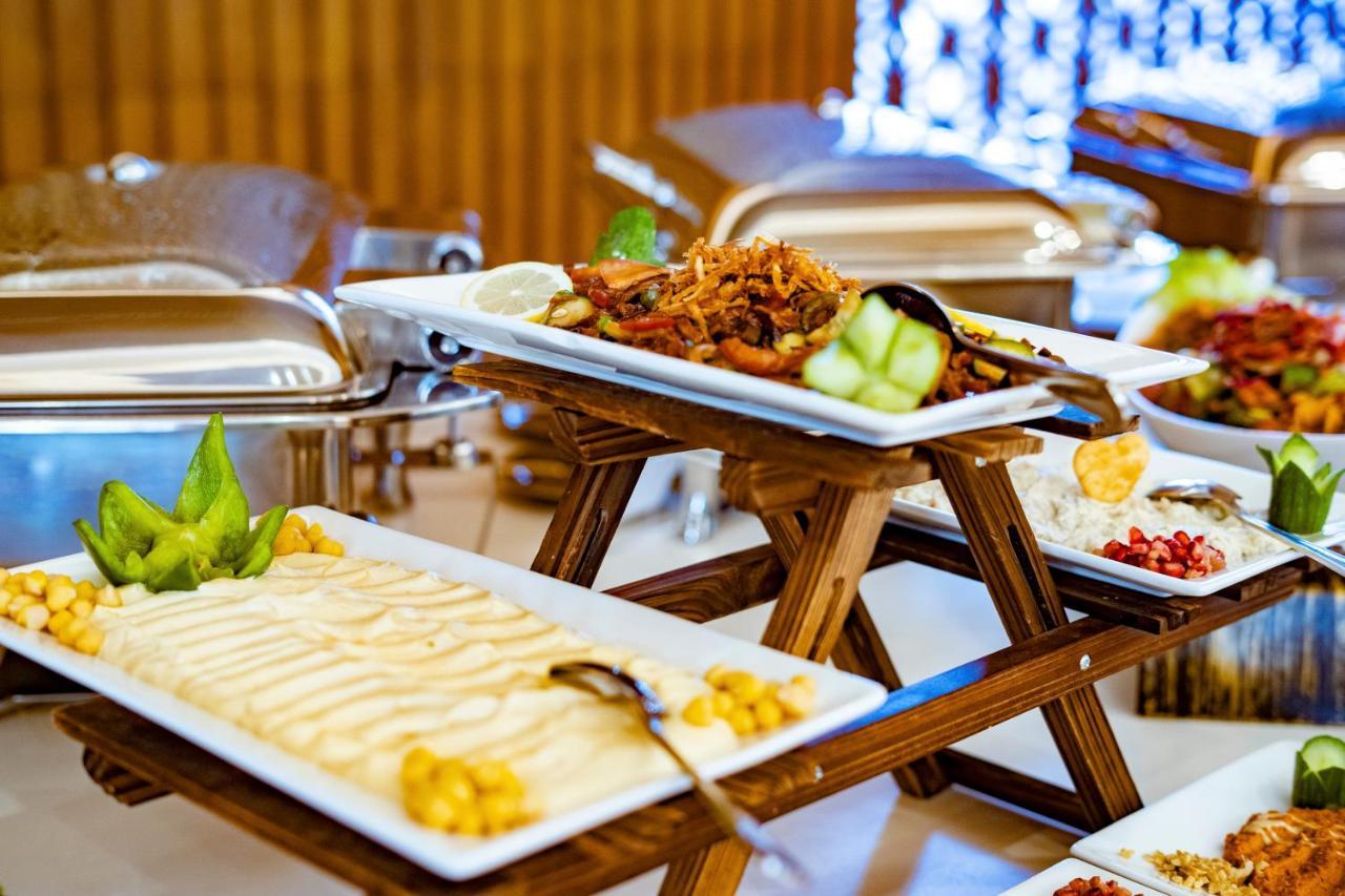 Luxe Grand Hotel Apartments Sharjah Luaran gambar A buffet at a hotel