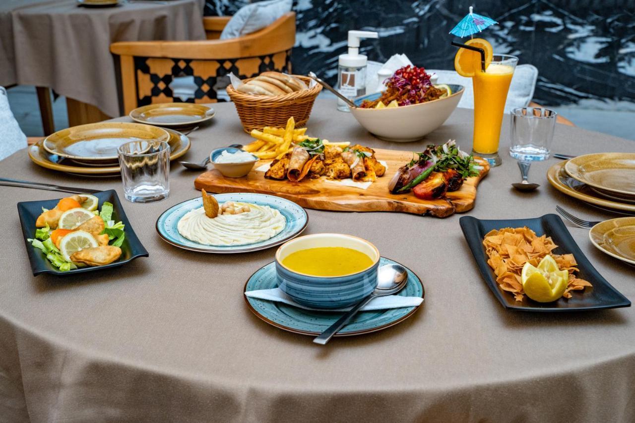 Luxe Grand Hotel Apartments Sharjah Luaran gambar A selection of Turkish cuisine