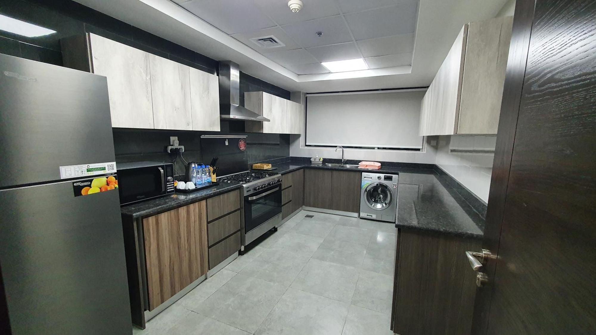 Luxe Grand Hotel Apartments Sharjah Luaran gambar A modern kitchen in Dubai